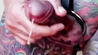 Jacques Kiross pierced and tatted manhood shoots jism thru a dual fuck hole