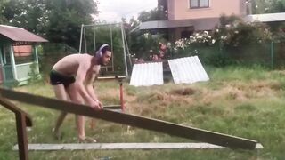 Rimolzovich sawing the board.