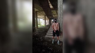 A unshaved, heterosexual chav fellow in a balaclava and stinky sneakers flashes his bone in a deserted palace