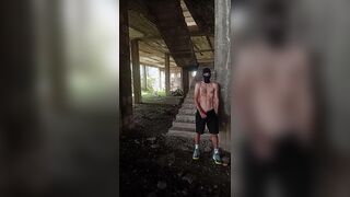 A unshaved, heterosexual chav fellow in a balaclava and stinky sneakers flashes his bone in a deserted palace