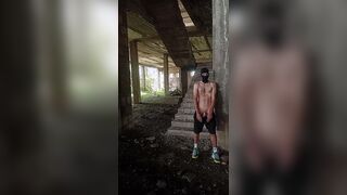 A unshaved, heterosexual chav fellow in a balaclava and stinky sneakers flashes his bone in a deserted palace