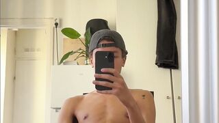 School man draining off in his dormitory apartment