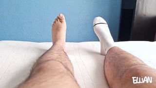 School guy fondles his soles, taking off his lengthy, perspiring socks