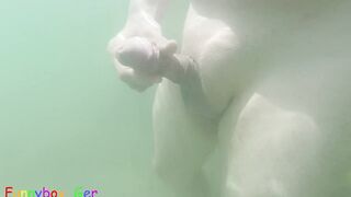 Naked sphere bathing in a mountain lake and masturbating off my bald boner underwater.