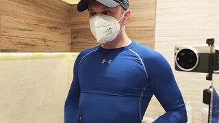 Hooded Teddy Flexing in a Taut Blue Compression T-shirt