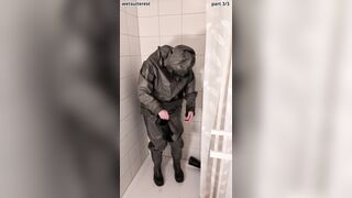 Disrobing sweat-soaked strenuous love glove Zodiac Zodiak hazmat suit with condom mittens, footwear, plastic trousers, gas mask