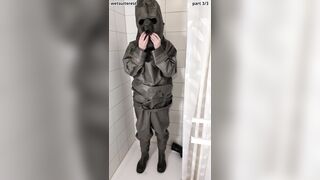 Disrobing sweat-soaked strenuous love glove Zodiac Zodiak hazmat suit with condom mittens, footwear, plastic trousers, gas mask