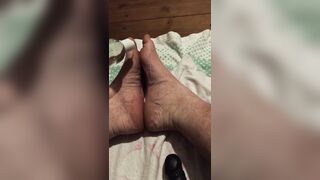 Caressing my soles with lubricant