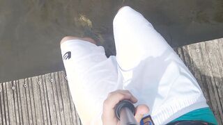 Entirely dressed swim in lake and sagging cutoffs