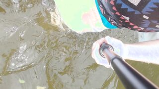 Entirely dressed swim in lake and sagging cutoffs