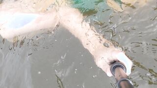 Swimming in undergarments and jacking under water