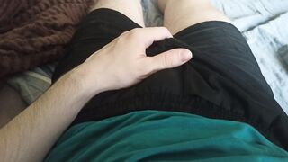 A boy in cutoffs erotically jerks his goods