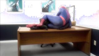 spiderman ravages robber he finds in an office
