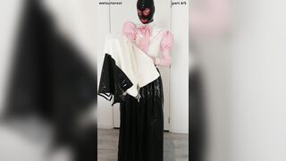 Putting on spandex student uniform t-shirt over love glove microskirt, half-top, spandex layers