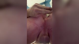 Sleek plump sissy butt-plugs her crevice while encaged.