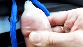 The boy crammed the rubber to the top with nut nectar while sitting in the truck