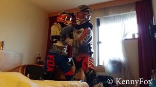 Ficht in motocross gear over who is going to be the bottom