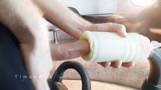 Nasty boy poked a vacuum cleaner while cleaning the building