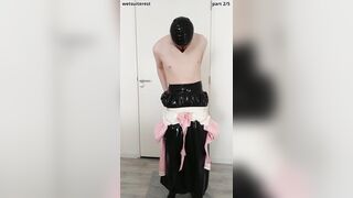 Putting on pinkish frilly spandex half-shirt over lengthy protection micro-skirt, maid pantyhose, undies, layers