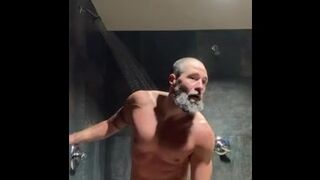 Bearded muscled jock urinates in gym locker guest room douche