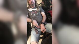 Longhairdude shoots onto RedWing shoes in jeans cut-offs and Anarchy tshirt