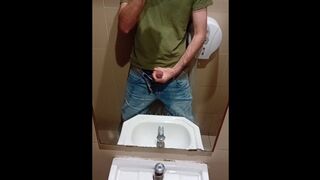 heterosexual dude in blue denim drains off in public wc