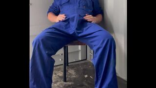 Farm fellow in overalls plays at work