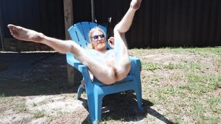 Naturist basks in the sun with his prick and butt out for showcase