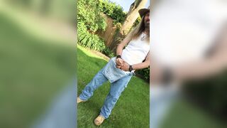 Longhairdude breaks one of in the garden in OshKosh dungerees overalls, work footwear, cowboy hat