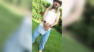 Longhairdude breaks one of in the garden in OshKosh dungerees overalls, work footwear, cowboy hat