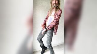 Longhairdude hippie shooting in lean zebra denim, rosy cheetah t-shirt, pentagram, square toe shoes