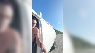 Checking why back camper door rattling. Side of the road. Nude.