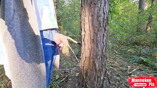 On a walk in the woods, lengthy urinating under a tree