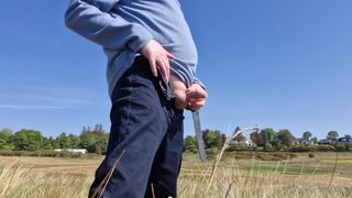 Urinating In Public. Taking A Pee On The Golf Course.