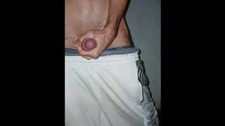 Bony bulky fellow jacks off in cutoffs and finishes off standing in homemade bedroom