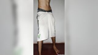 Bony bulky fellow jacks off in cutoffs and finishes off standing in homemade bedroom