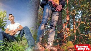 Fellow lengthy peeing in the woods under a tree