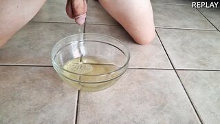 Rear end-fashion bare stud pisses in a cup