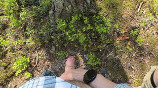 Furry fellow and his uncircumcised acquaintance piss on the side of road in forest next to Tesla truck. Outdoor peeing