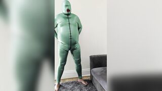 Cum shot in utter emerald green spandex and sheated rubber hood