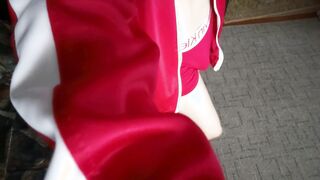 Thin dude poses in tracksuit and takes off