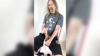 Longhairdude milks and shoots in gym trackie cutoffs and Mickey Mouse skeleton tshirt