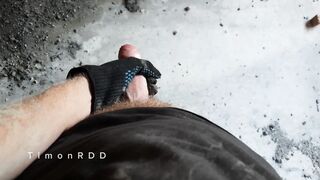 A builder determined to drain excess seed while smoking