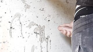 A builder determined to drain excess seed while smoking