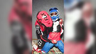 A dude in a motocross gear gets a dose on his mxhelmet