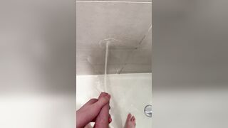 Lad urinates in the douche after nutting