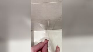 Lad urinates in the douche after nutting