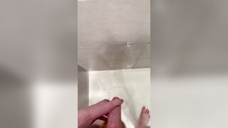 Lad urinates in the douche after nutting