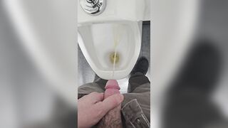 Pissing in urinal