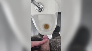 Pissing in urinal